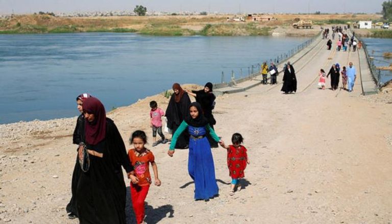 نزوح متواصل لأهالي الموصل من جحيم داعش - رويترز