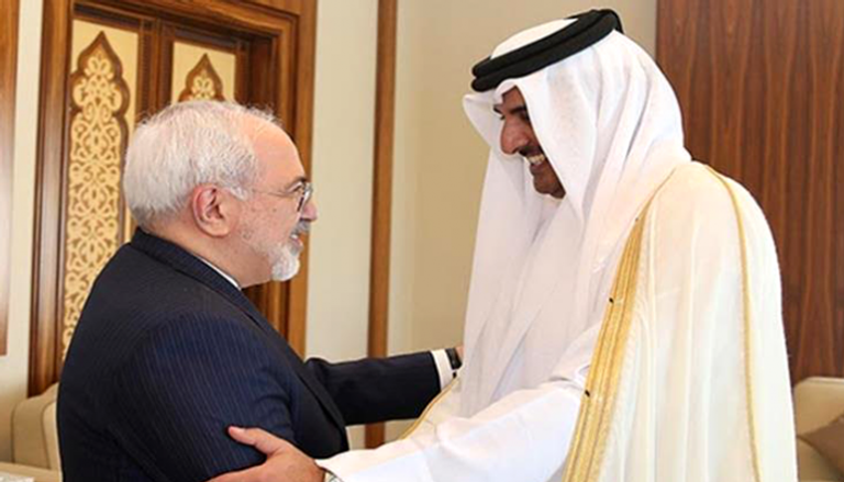 أمير قطر تميم بن حمد ووزير الخارجية الإيراني جواد ظريف