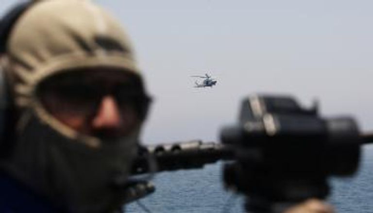 أمير قطر تميم بن حمد ووزير الخارجية الإيراني جواد ظريف