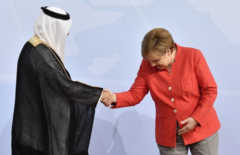 ميركل ووزير الدولة عضو مجلس الوزراء السعودي إر إبراهيم بن عبد العزيز العساف