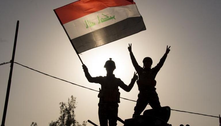 جنود عراقيون بعد إعلان النصر على داعش