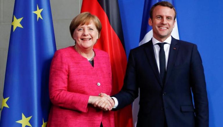 المستشارة الألمانية أنجيلا ميركل والرئيس الفرنسي إيمانويل ماكرون 