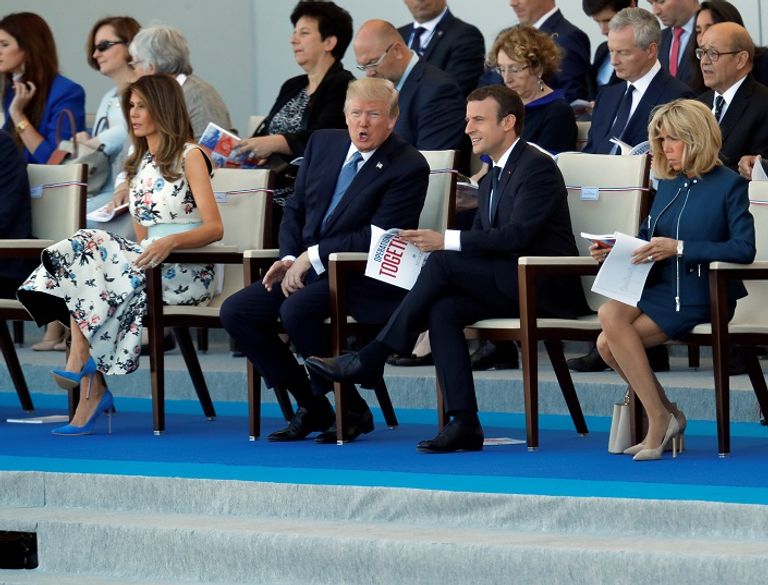 ماكرون خلال حضوره العرض العسكري- رويترز