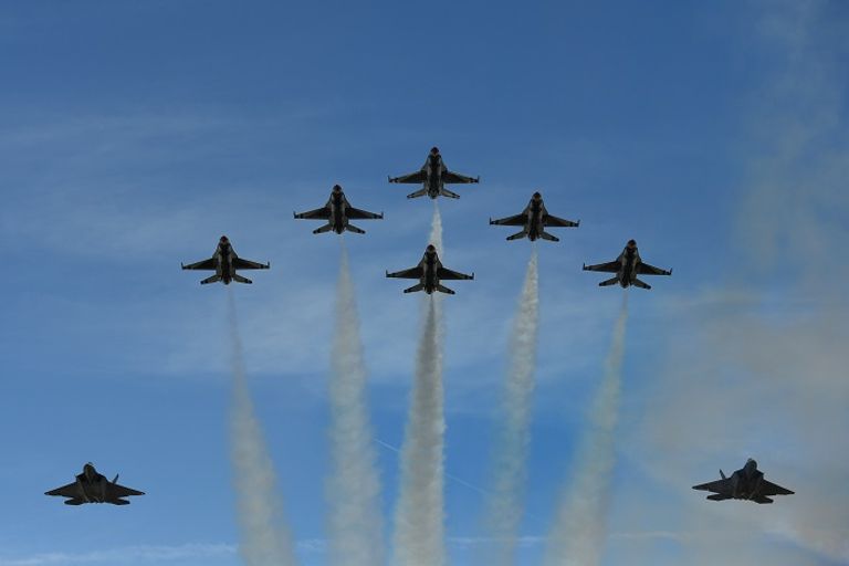 ماكرون خلال حضوره العرض العسكري- رويترز