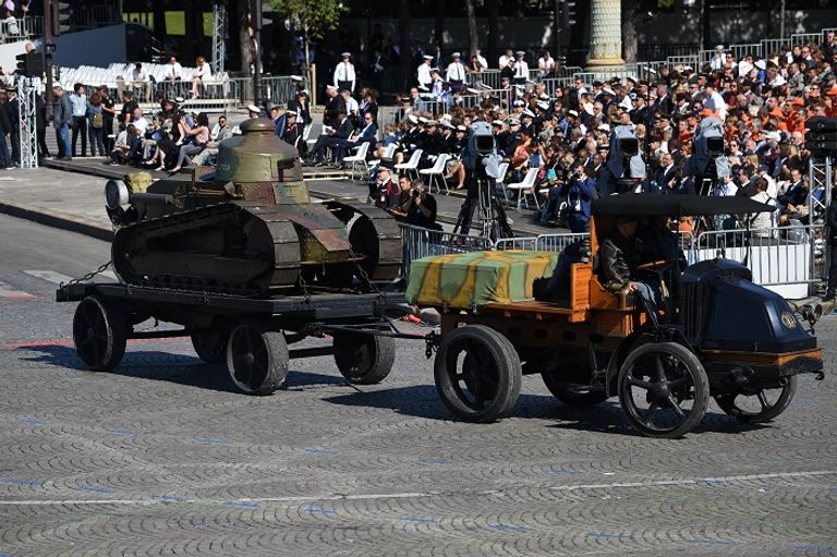 ماكرون خلال حضوره العرض العسكري- رويترز