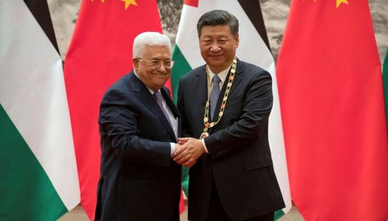 الرئيس الصيني ونظيره الفلسطيني- رويترز