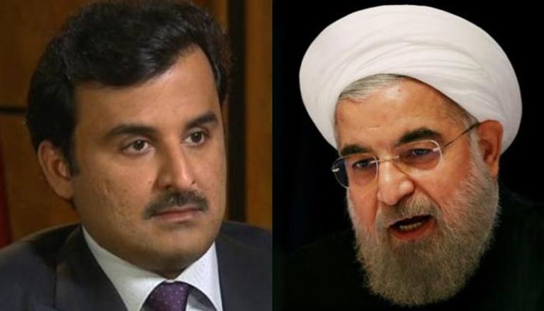 الرئيس الإيراني حسن روحاني وأمير قطر تميم بن حمد