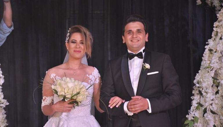 مصطفى خاطر وزوجته روان هلال
