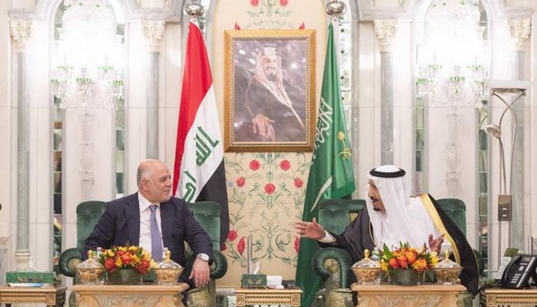 العاهل السعودي الملك سلمان ورئيس الوزراء العراقي حيدر العبادي