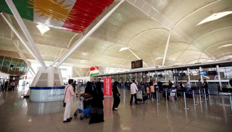 مسافرون في مطار أربيل - رويترز