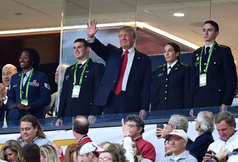 ترامب خلال تحية الجماهير - رويترز