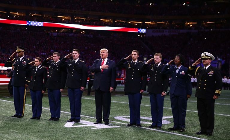 ترامب خلال تحية الجماهير - رويترز