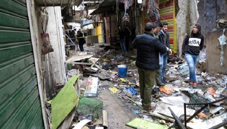 تفجير سابق هز سوق السنك التجاري ببغداد - أرشيفية