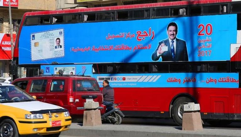 ملصق دعائي للانتخابات على حافلة ببغداد - أ. ف. ب