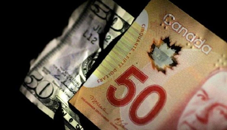 الدولار الكندي يرتفع مقابل الدولار - رويترز