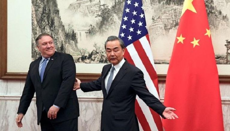 وزير الخارجية الصيني مع نظيره الأمريكي - رويترز