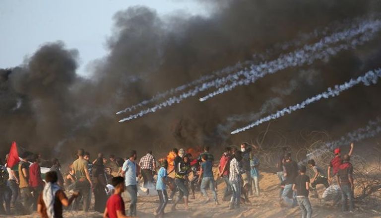 جانب من المواجهات بين الفلسطينيين وقوات الاحتلال - رويترز