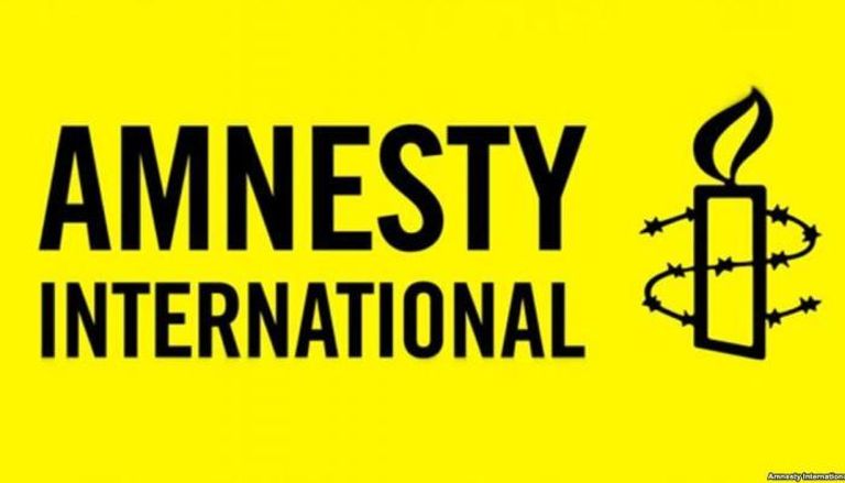 شعار منظمة العفو الدولية- أرشيفية