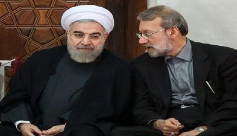 علي لاريجاني رئيس برلمان إيران والرئيس الإيراني حسن روحاني