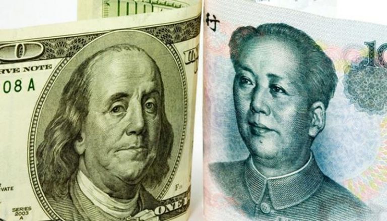 خفض سعر اليوان مقابل الدولار 