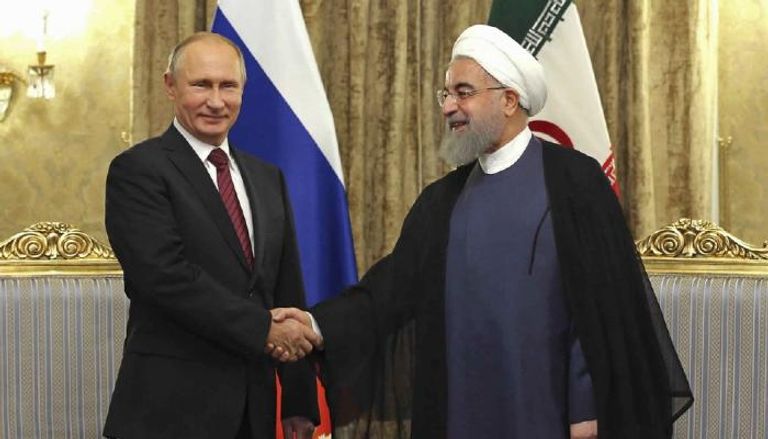 الرئيس الروسي فلاديمير بوتين مع نظيره الإيراني روحاني