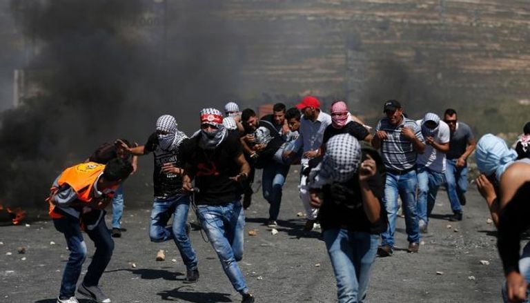جانب من المواجهات بين فلسطينيين وقوات الاحتلال الإسرائيلي