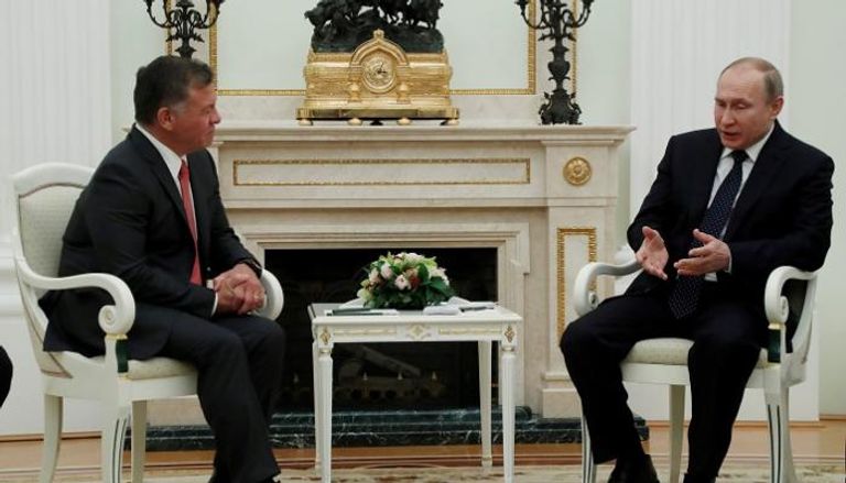 بوتين والعاهل الأردني خلال اجتماعهما في موسكو - رويترز