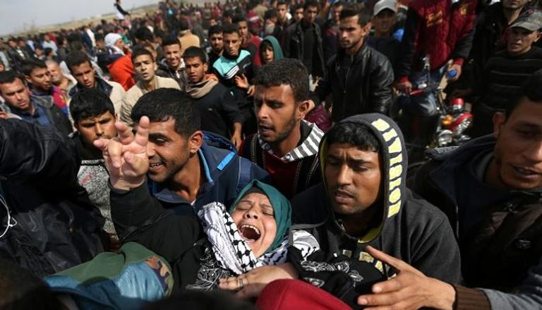 فلسطينية في مسيرات العودة بغزة - رويترز