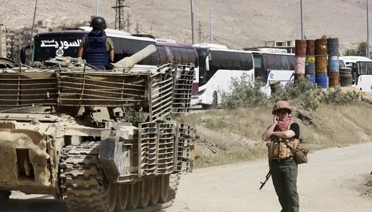 جانب من استعدادات خروج المقاتلين من الغوطة آليات جيش النظام السوري تتوغل في الغوطة الشرقية - أرشيفية