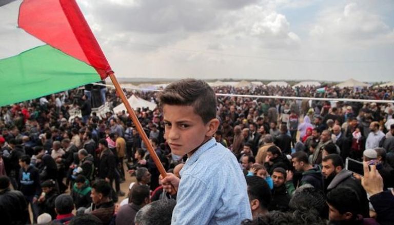 طفل فلسطيني في مسيرة يوم الأرض- أرشيفية