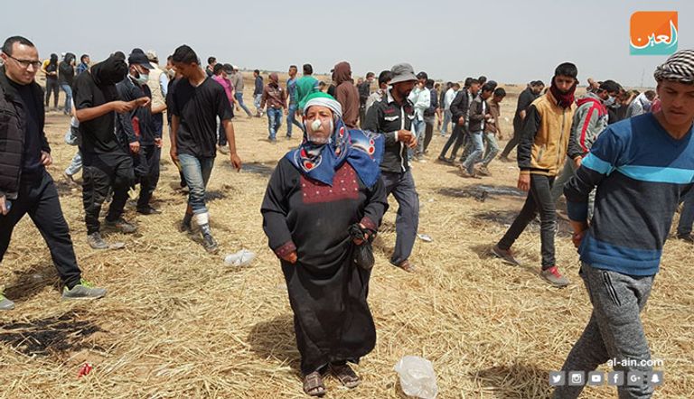 متظاهرون خلال مسيرة الجمعة الماضية