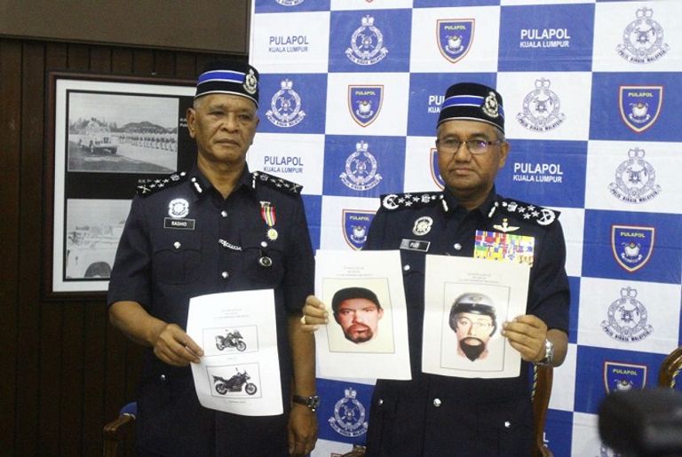 مؤتمر الشرطة الماليزية خلال كشفها عن المشتبه بهما في حادث اغتيال البطش