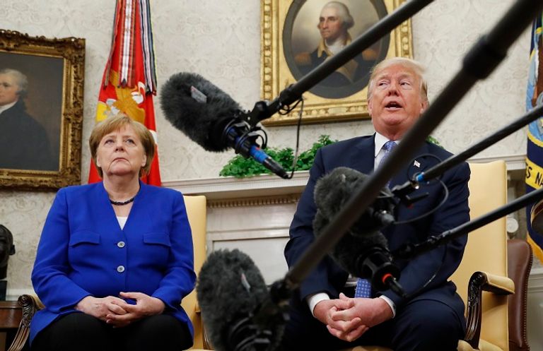 ترامب وميركل - رويترز