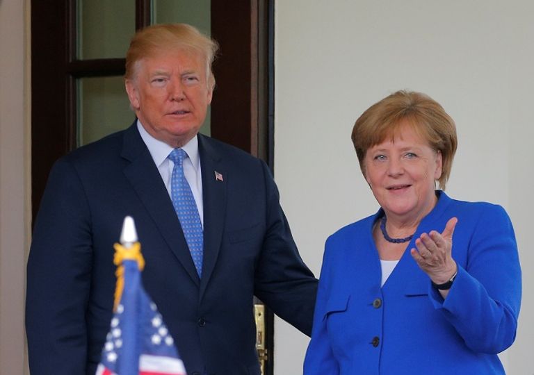 ترامب وميركل - رويترز