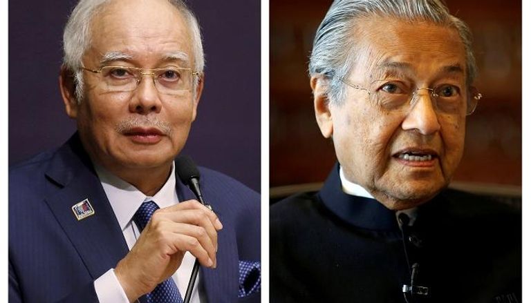 مهاتير محمد ونجيب عبد الرزاق- رويترز مهاتير محمد يدلي بصوته في الانتخابات (أ ف ب)