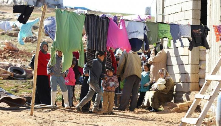 لاجئون سوريون في أحد المخيمات بلبنان