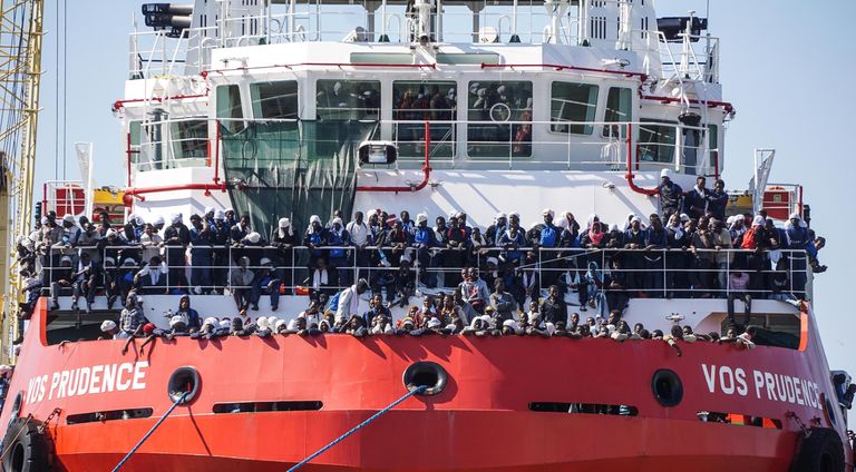 ماكرون وميركل خلال القمة الأوروبية بشأن الهجرة