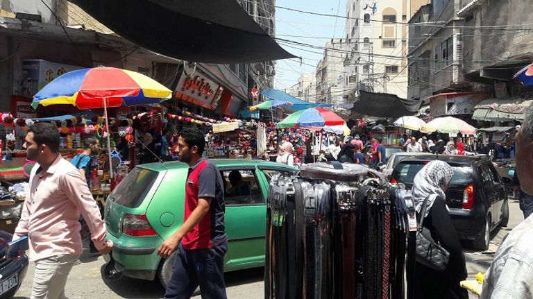 شارع تجاري في قطاع غزة يعاني من الأزمة الاقتصادية أطفال غزة بانتظار بارقة أمل