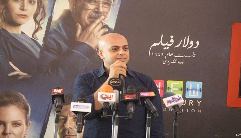 آسر ياسين وأحمد مراد خلال حفل التوقيع