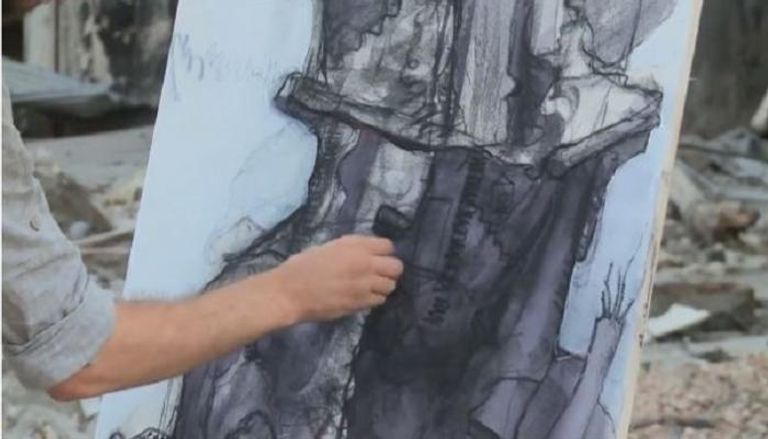 رسامون يجسدون الدمار بمخيم اليرموك في لوحاتهم الفنية
