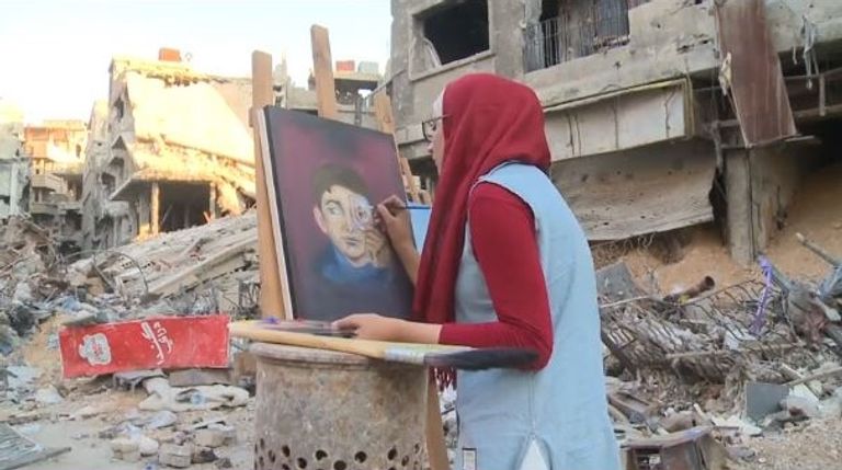 رسامون يجسدون الدمار بمخيم اليرموك في لوحاتهم الفنية