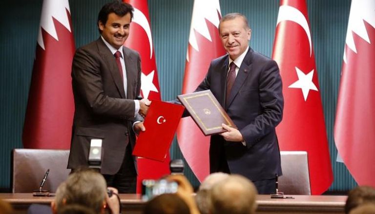 جانب من توقيع اتفاق الاحتلال العسكري بين قطر وتركيا