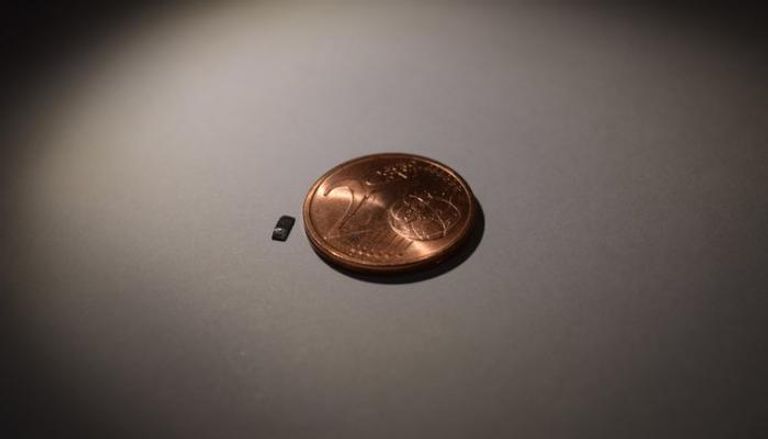 روبوتات صغير بجوار عملة معدنية ـ أرشيفية