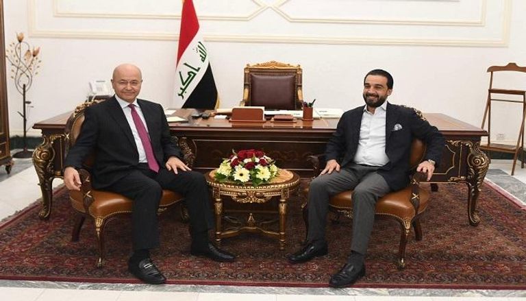 الرئيس العراقي برهم صالح خلال لقاء رئيس مجلس النواب محمد الحلبوسي