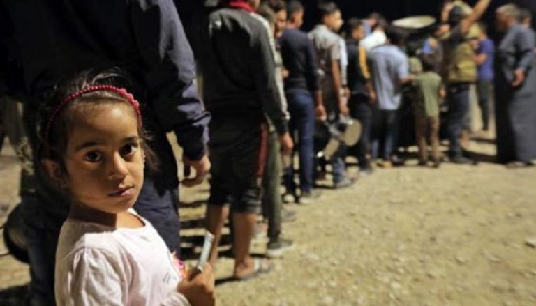 سوريون فارون من العدوان التركي إلى مخيم بردرش بالعراق