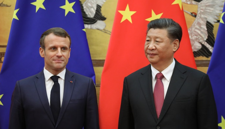 الرئيس الصيني شي جين بينج ونظيره الفرنسي إيمانويل ماكرون