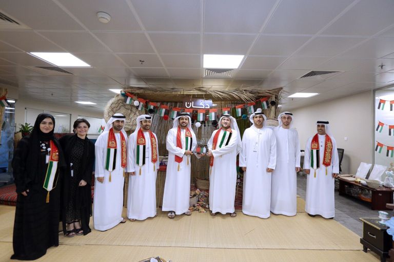 جانب من احتفالات سوق أبوظبي للأوراق المالية باليوم الوطني