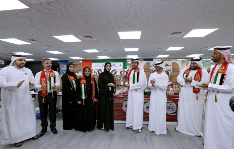 جانب من احتفالات سوق أبوظبي للأوراق المالية باليوم الوطني