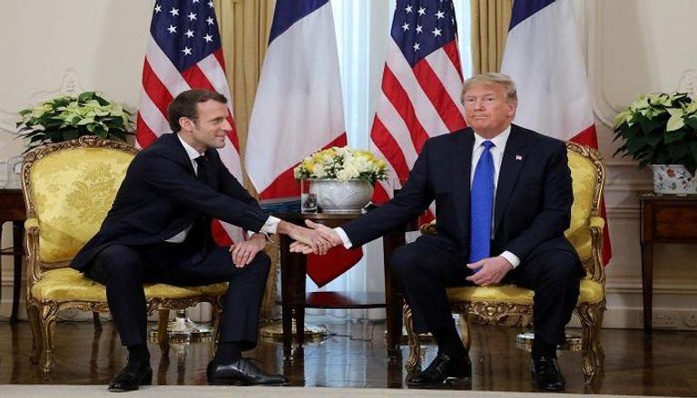 الرئيس الأمريكي خلال الاجتماع مع نظيره الفرنسي - أ.ف.ب