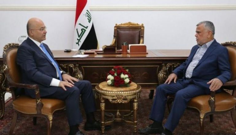 الرئيس العراقي برهم صالح والقيادي في تحالف البناء هادي العامري